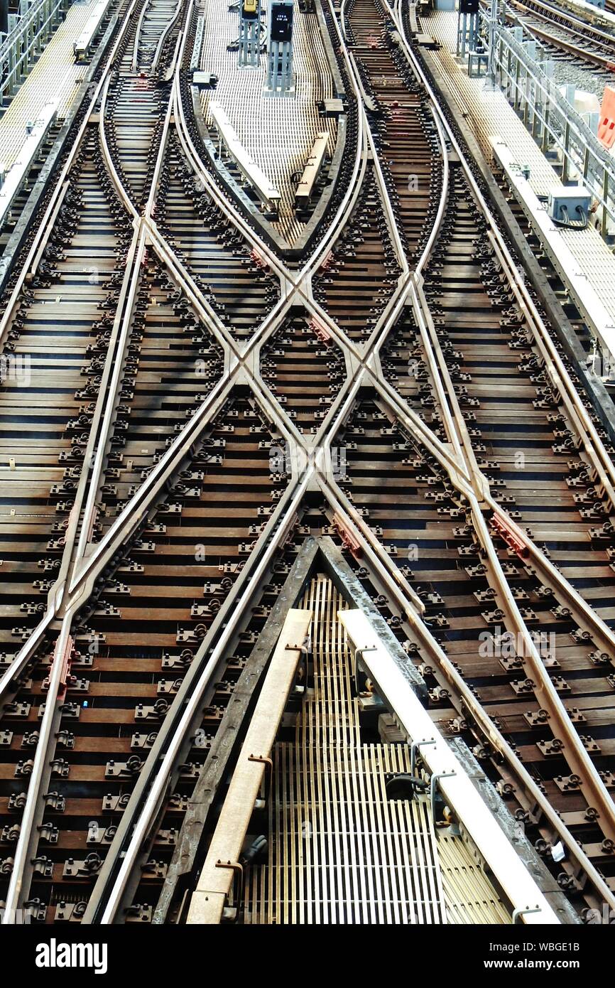 High Angle View Of Crisscross Railroad Tracks At Railway Station ...