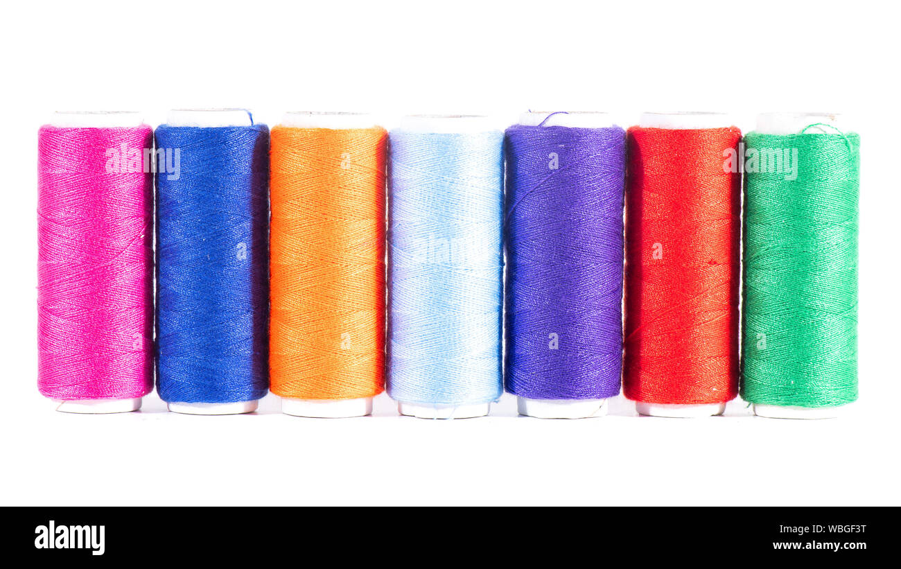 Some skeins of colored sewing threads Stock Photo - Alamy