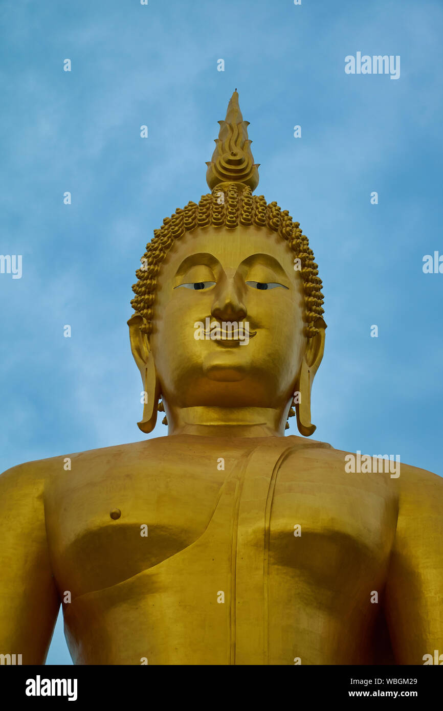 A giant, gold sitting Buddha at Wat Muang in Ang Thong, Thailand. Stock Photo