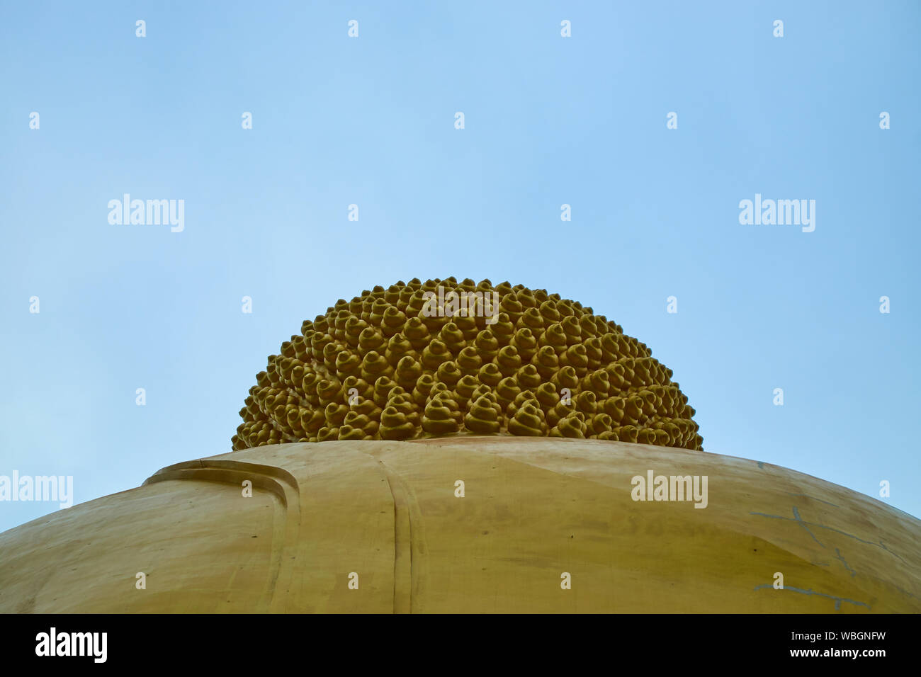 A look at the back of the head of the giant, gold, sitting Buddha at Wat Muang in Ang Thong, Thailand. Stock Photo