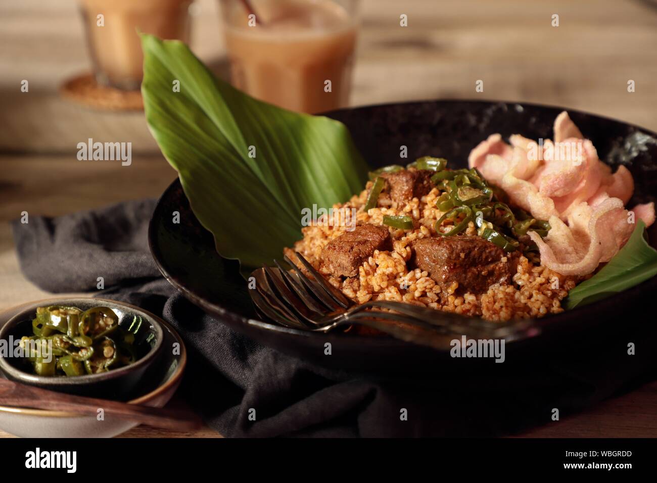 Nasi Goreng Rendang. Indonesian fried rice with Beef Rendang and its spice mix Stock Photo
