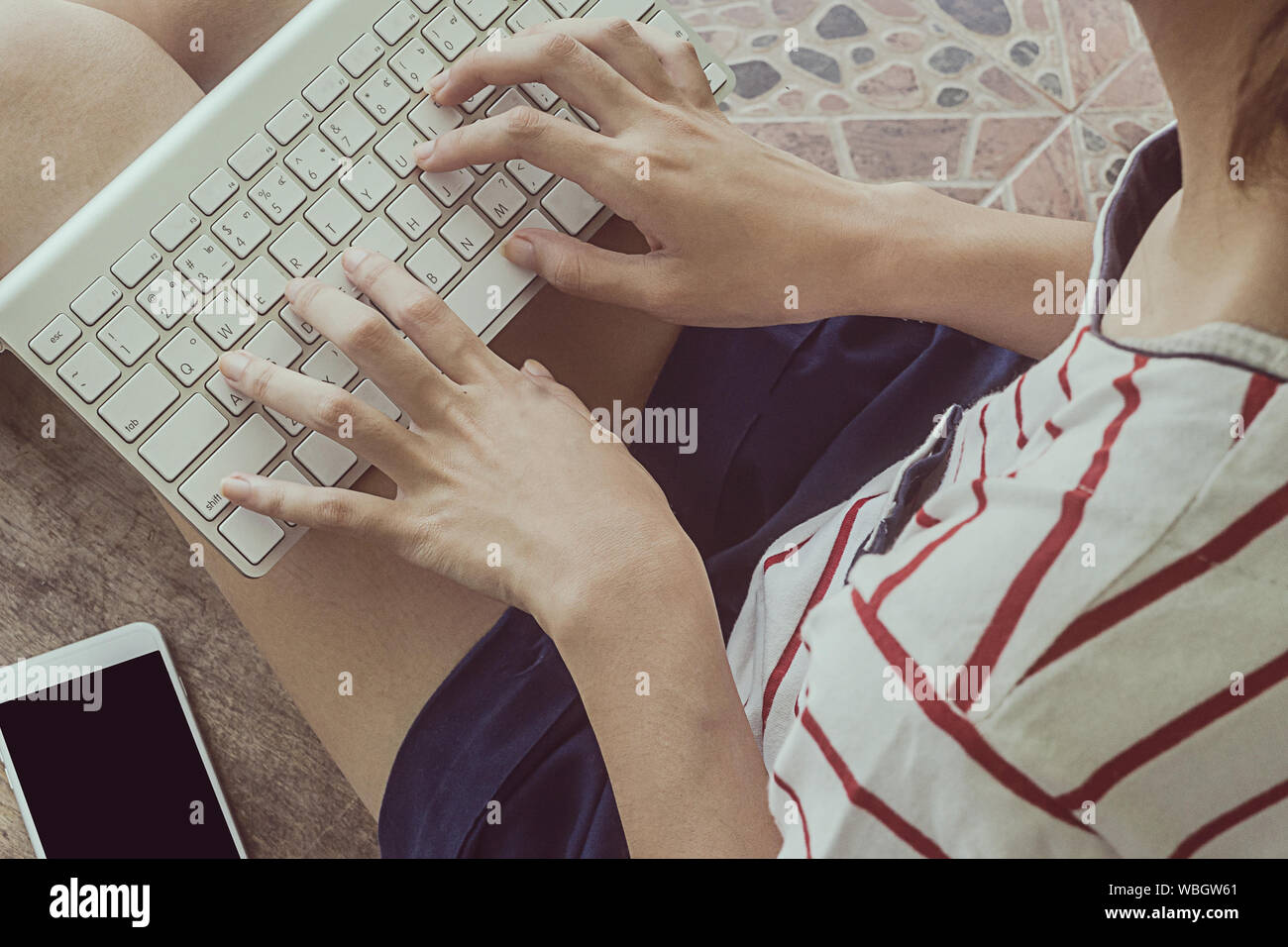 High Angle View Of Woman Typing Stock Photo