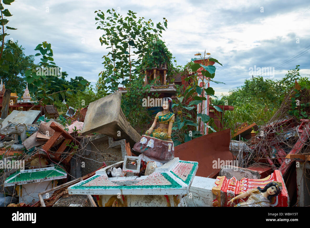 Junk yard area of discarded small temple alters at Wat Luang Sunthraram in Ang Thong, Thailand. Stock Photo