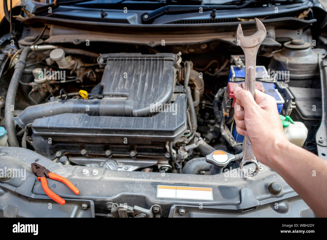 Automotive mechanic hand holding wrench at the garage Stock Photo Alamy
