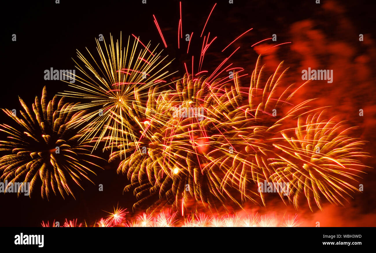 Colorful fireworks in night sky background Stock Photo - Alamy