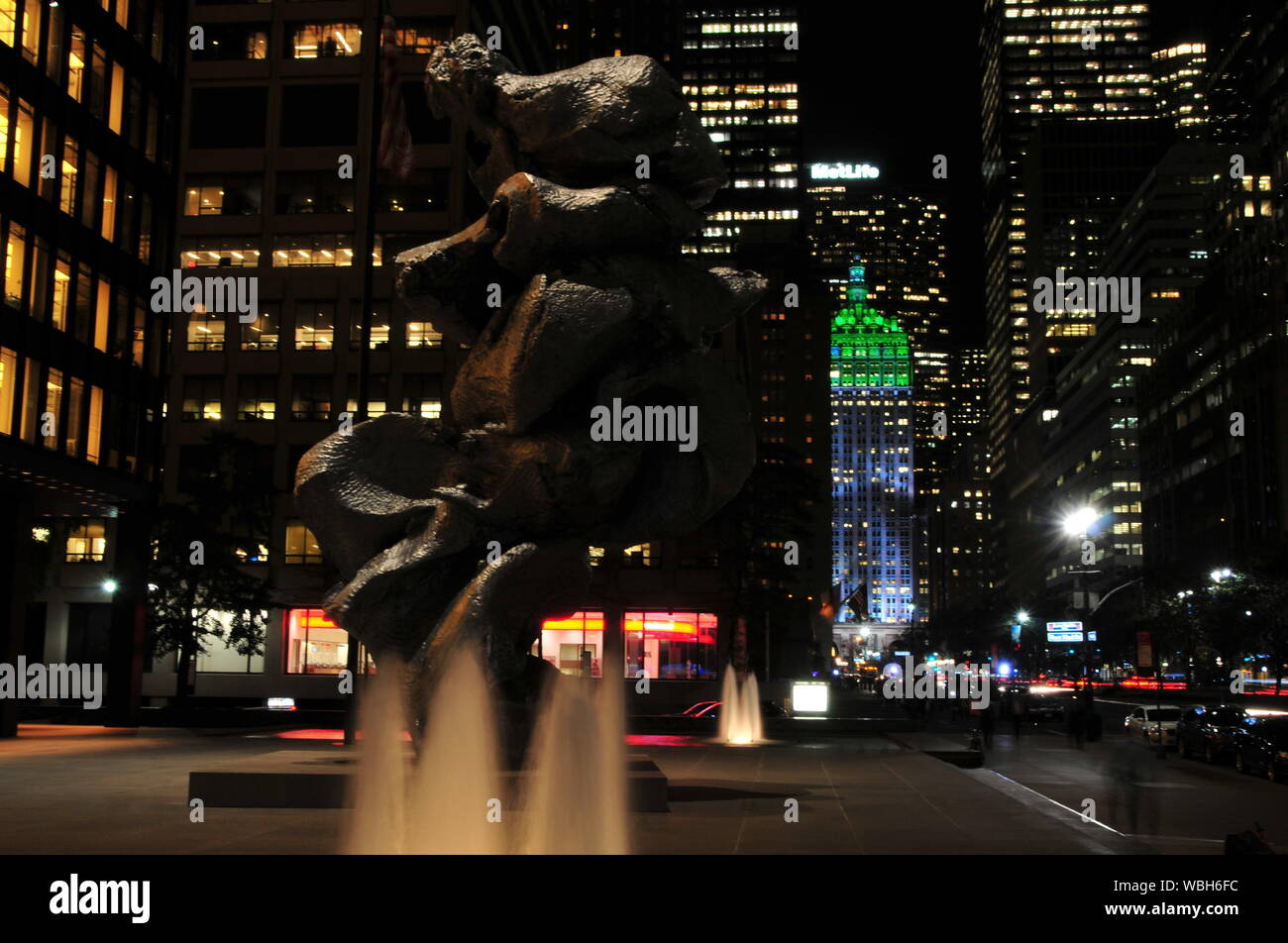 Sculpture In Illuminated City At Night Stock Photo