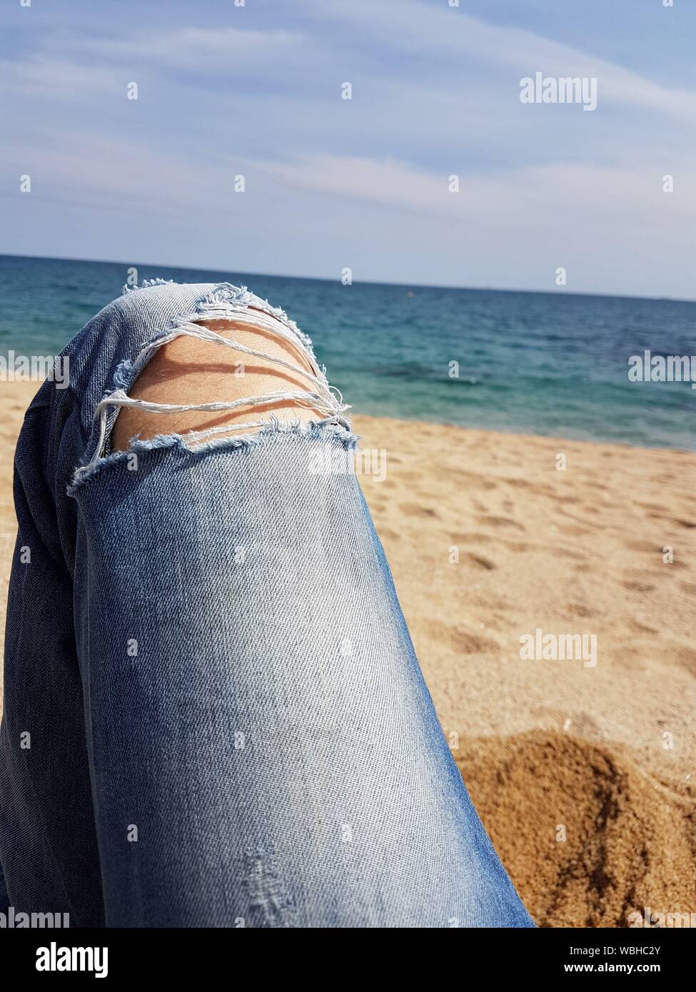 Woman wearing jeans beach hi-res stock photography and images - Alamy