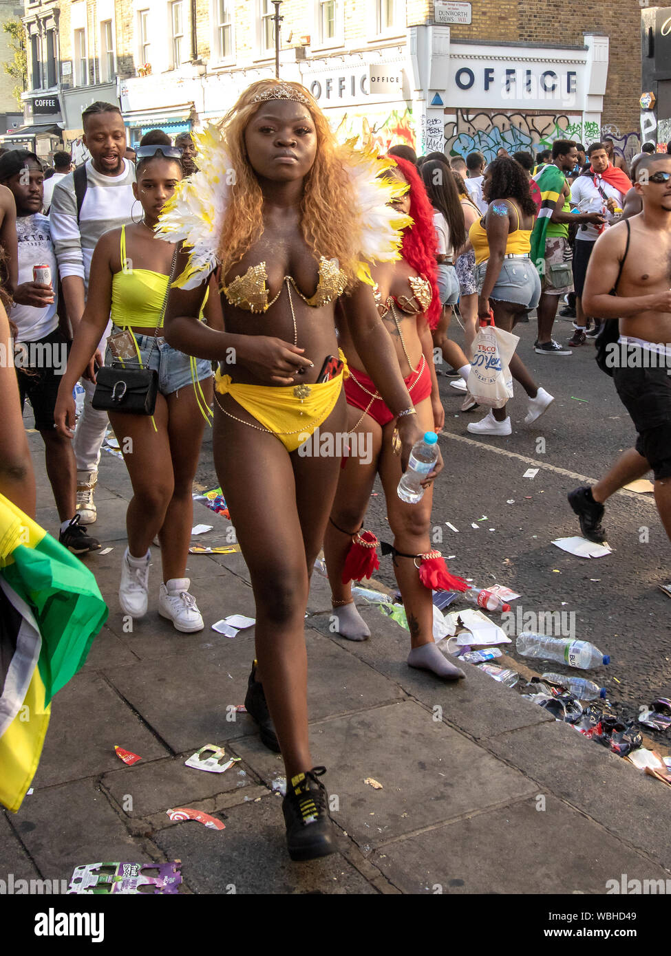 A female masquerader. Notting Hill Carnival 2019 continued on Bank Holiday Monday, with over a million revellers hitting the streets of West London, amongst floats, masqueraders, steel bands, and sound systems. Stock Photo
