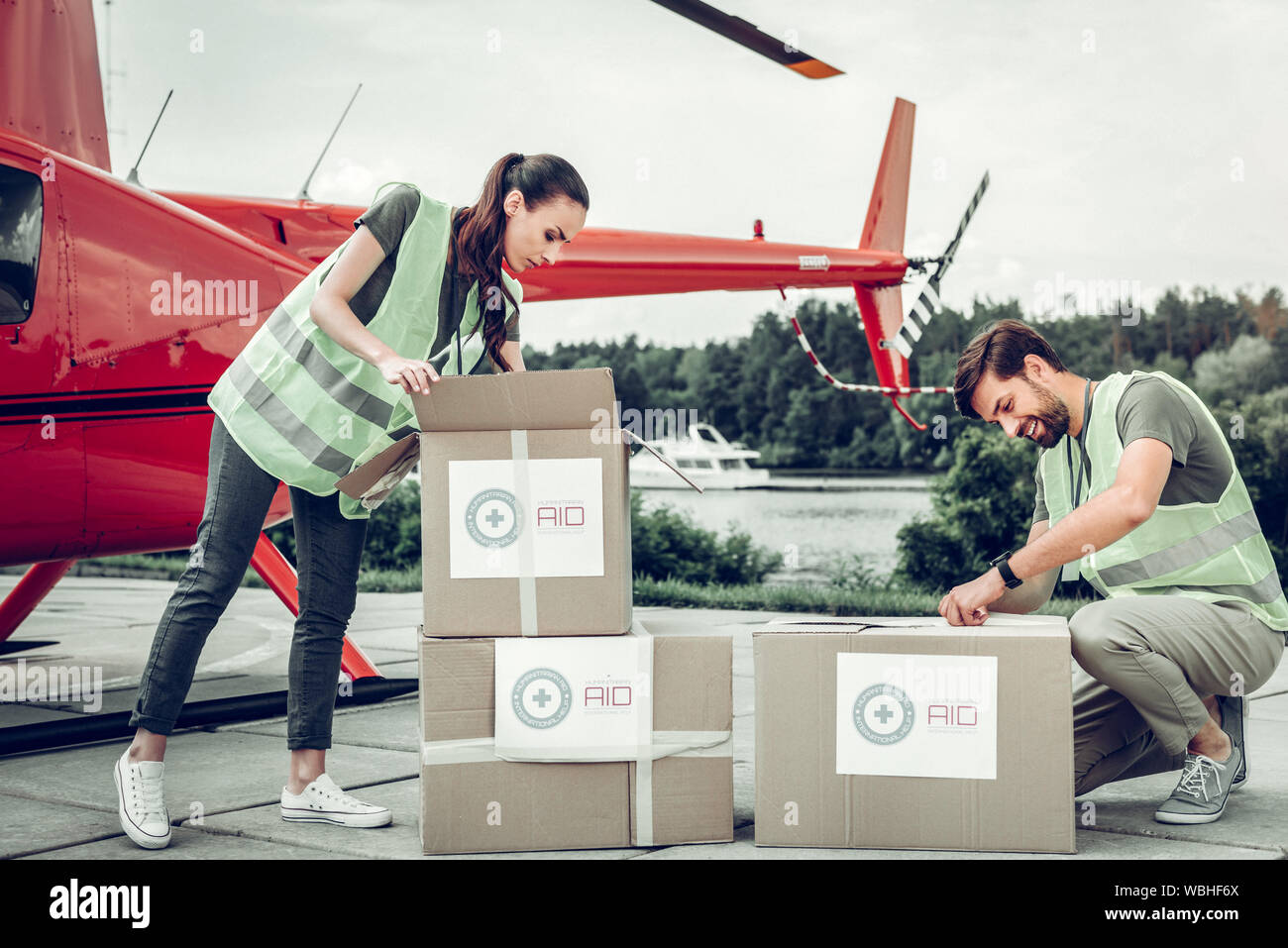 Humanitarian workers unpacking boxes after receiving them Stock Photo