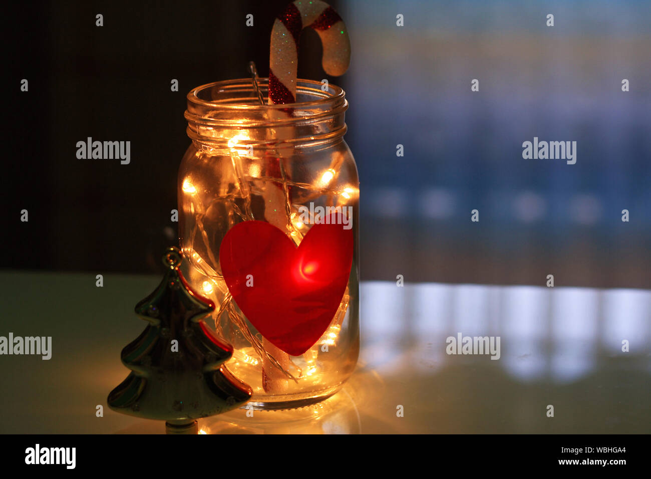 Close-up Of Illuminated Christmas Lights And Candy Cane In Glass Jar Stock  Photo - Alamy