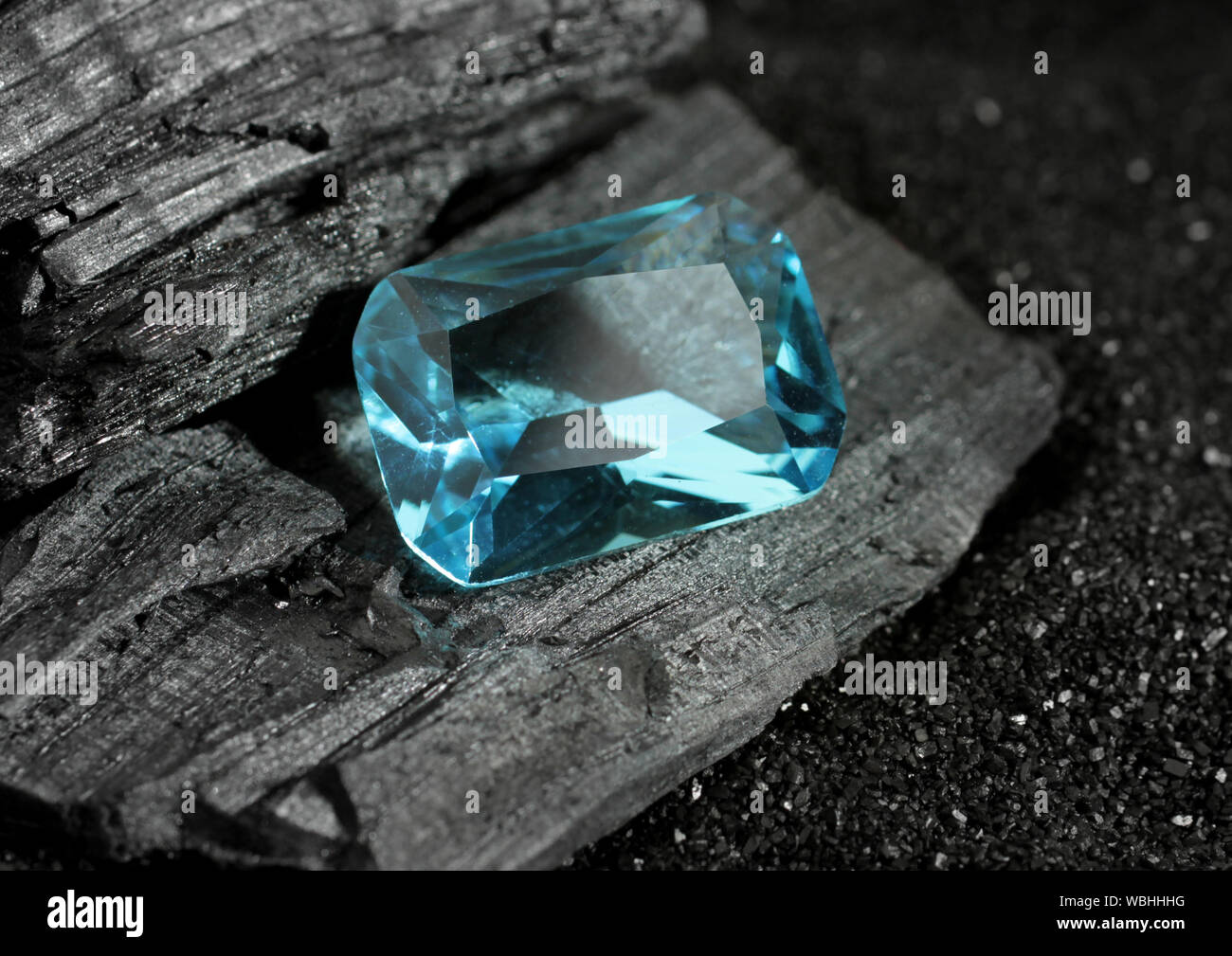 faceted blue jewelry gemstone aquamarine on black background Stock Photo