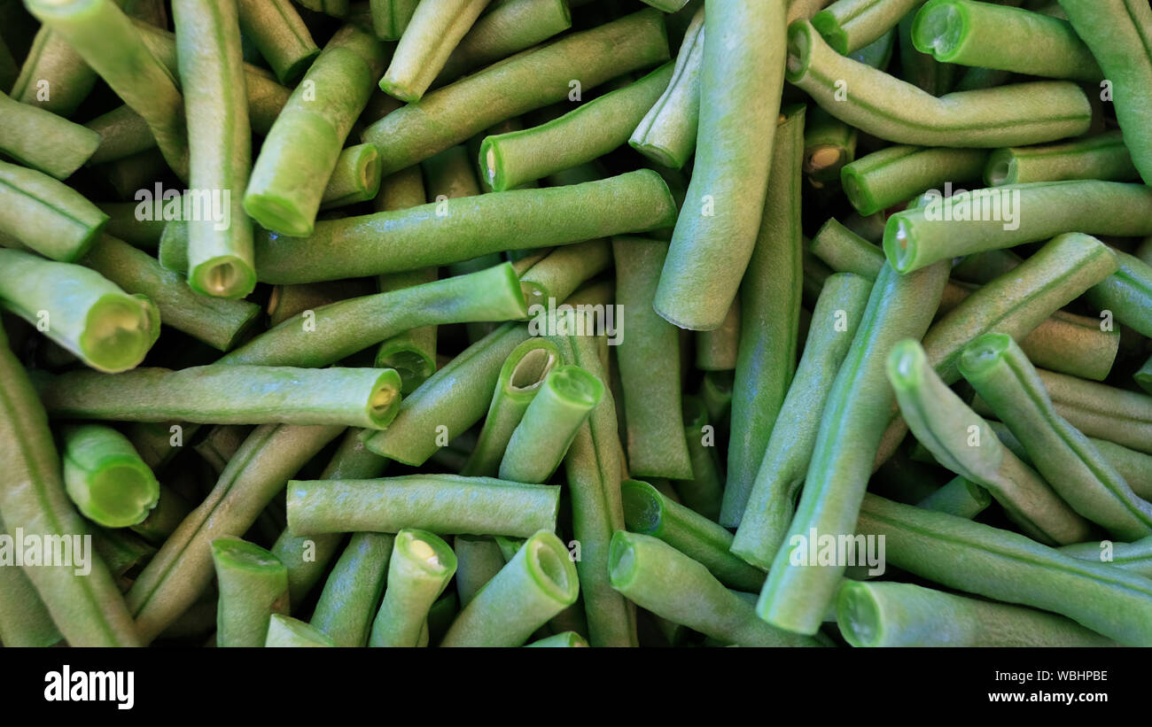 Raw french beans known also as haricot vert, cleaned and cut in short  segments, ready to be used in a vegetarian, vegan or as side dish Stock  Photo - Alamy
