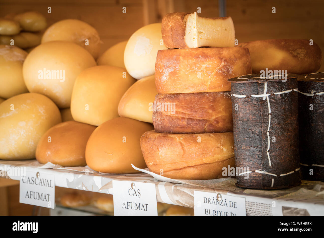 Variety of traditional romanian  smoked sheep cheeses on a shelf Stock Photo