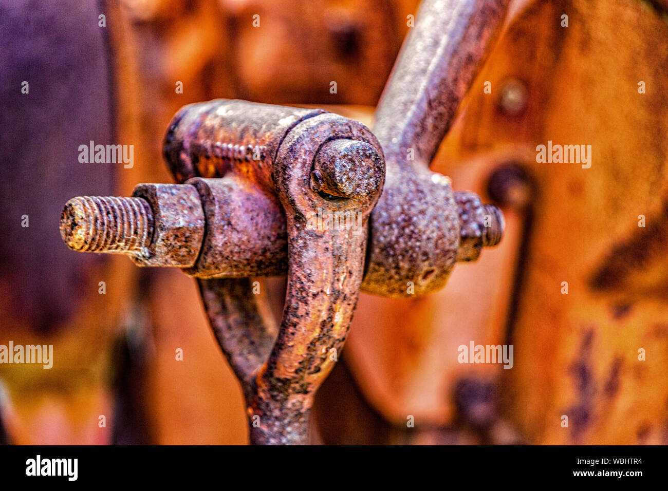 Close-up view of rusted joint on an abandoned tractor Stock Photo