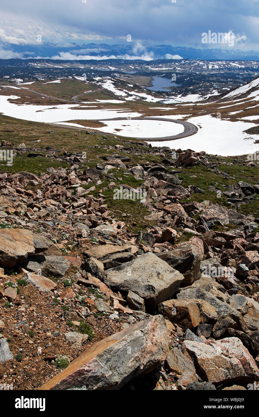 Snow covered mountains and low cloud from the Bear Tooth Pass Wyoming USA June 2015 Stock Photo