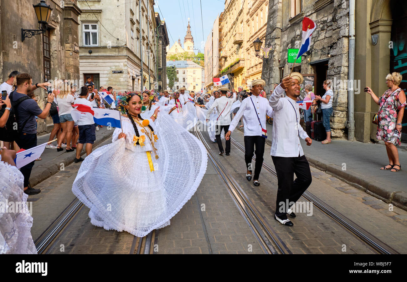Panama Folklore group dancing down streets during closing Parade of Etnovyr Festival in street of Lviv, Ukraine Stock Photo