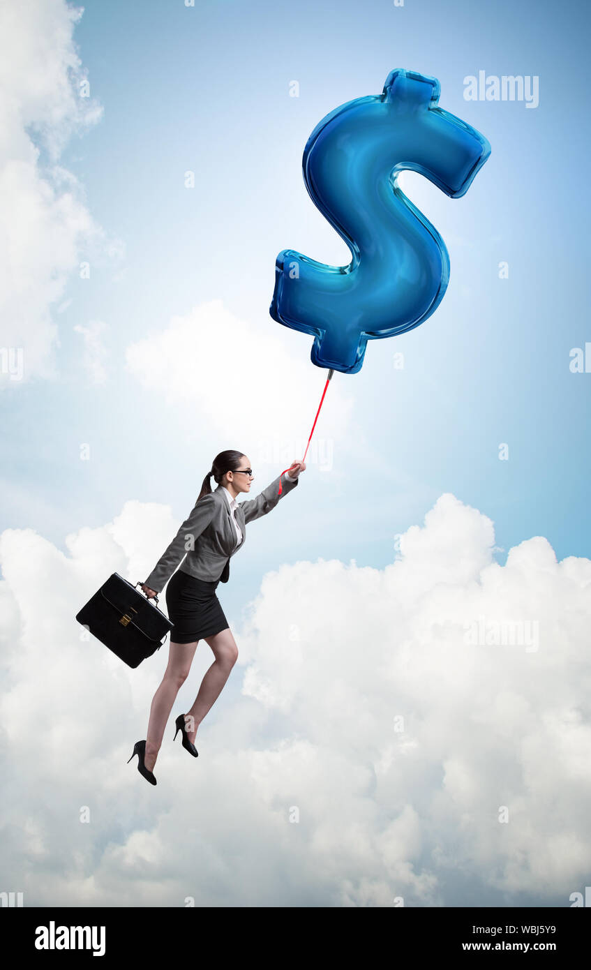 The businesswoman flying on dollar sign inflatable balloon Stock Photo ...