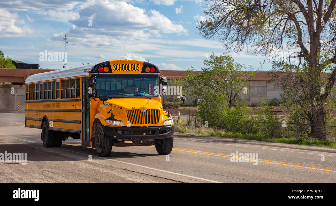 Chinle Arizona, USA. May 17, 2019. Classic yellow school bus on the road, sunny spring day Stock Photo