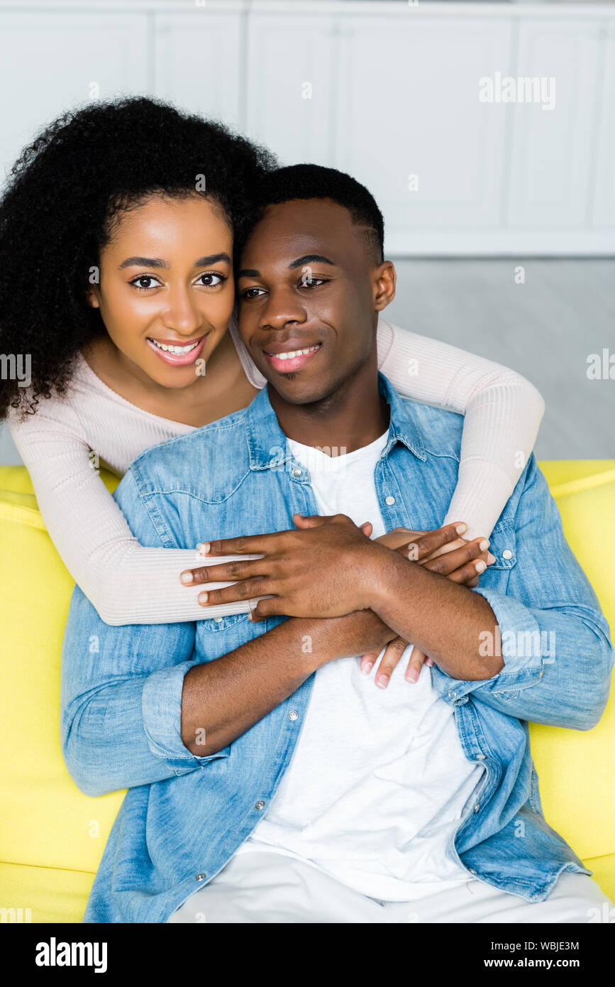 high angle view of happy african american woman hugging boyfriend and ...