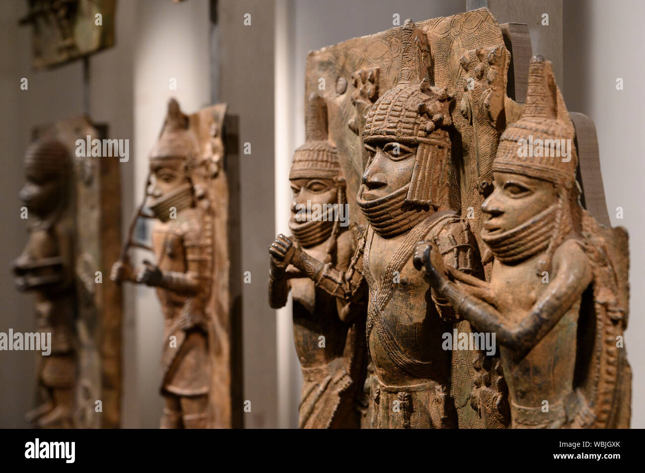 London. England. Benin Bronzes on display at the British Museum, brass plaques from the royal court palace of the Kingdom of Benin, 16-17th century. Stock Photo