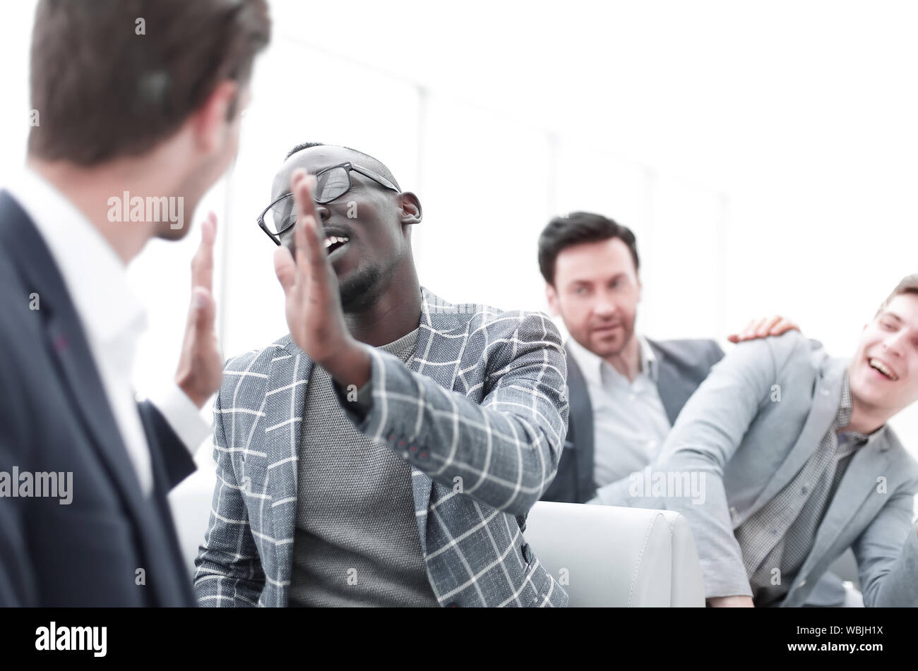 successful employees giving each other a high five Stock Photo - Alamy