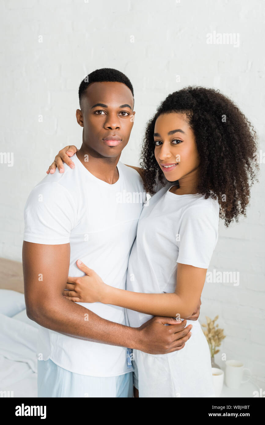 African american couple cuddling in bed hi-res stock photography and ...