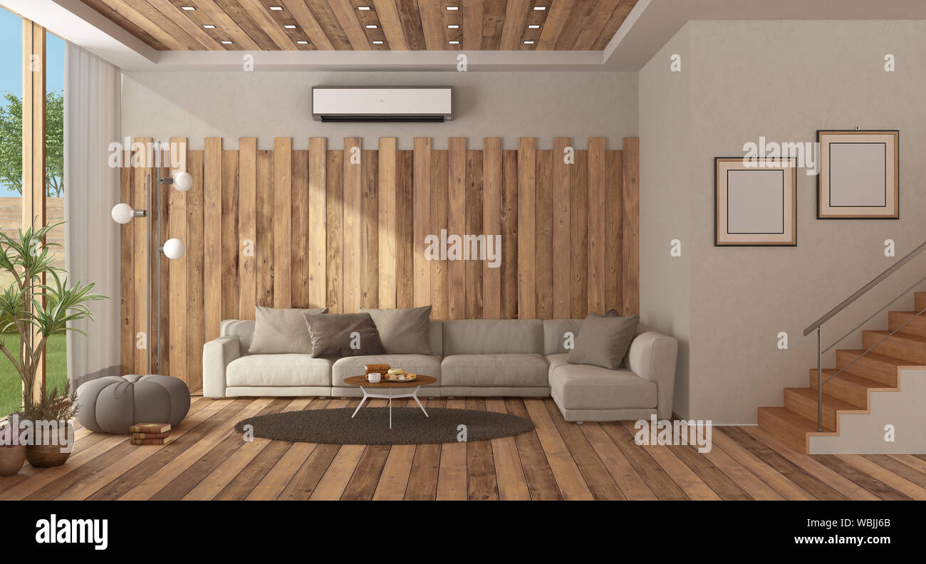 Modern living room with sofa against wooden wall and staircase - 3d rendering Stock Photo