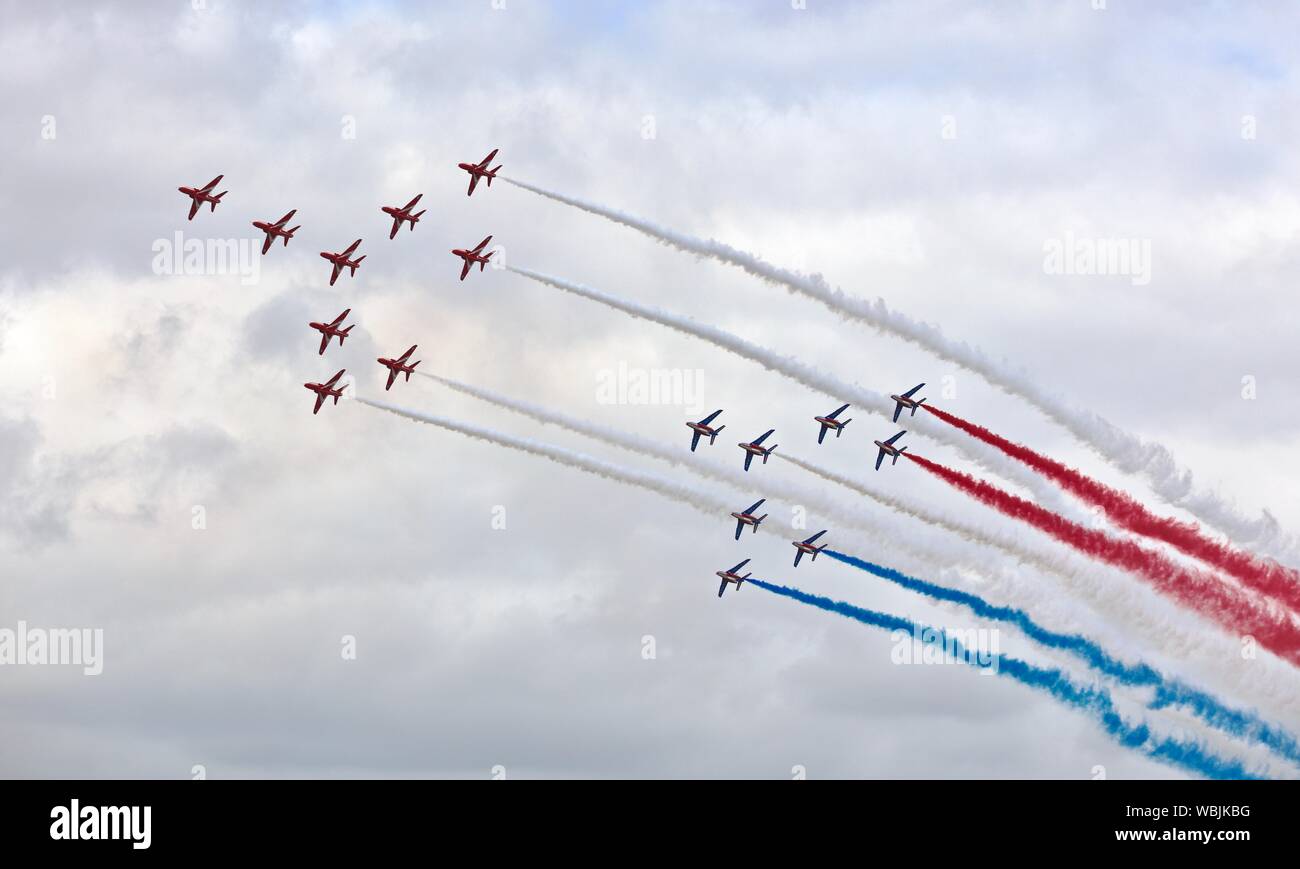 The Red Arrows and the Patrouille de France flying in Concorde formation celebrating the 50th anniversary of its first maiden flight at the 2019 RIAT Stock Photo