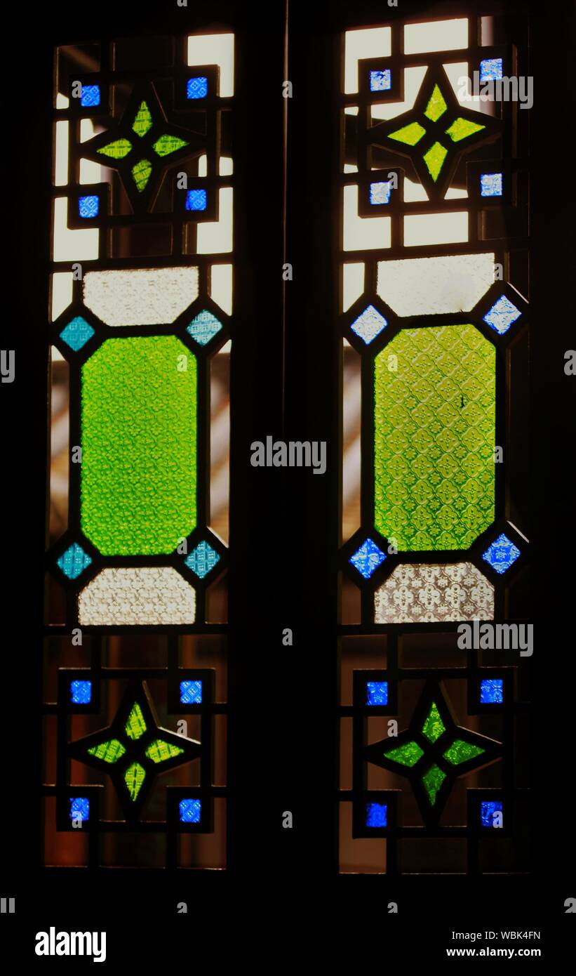 Blue and green stained glass window hires stock photography and images