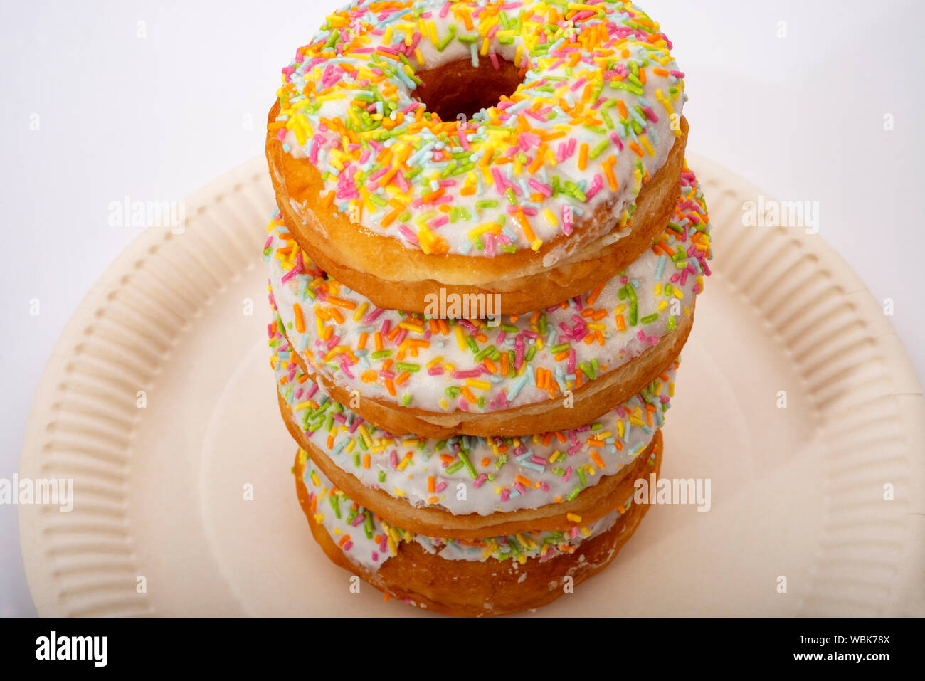 Ring doughnuts with rainbow sprinkles Stock Photo Alamy