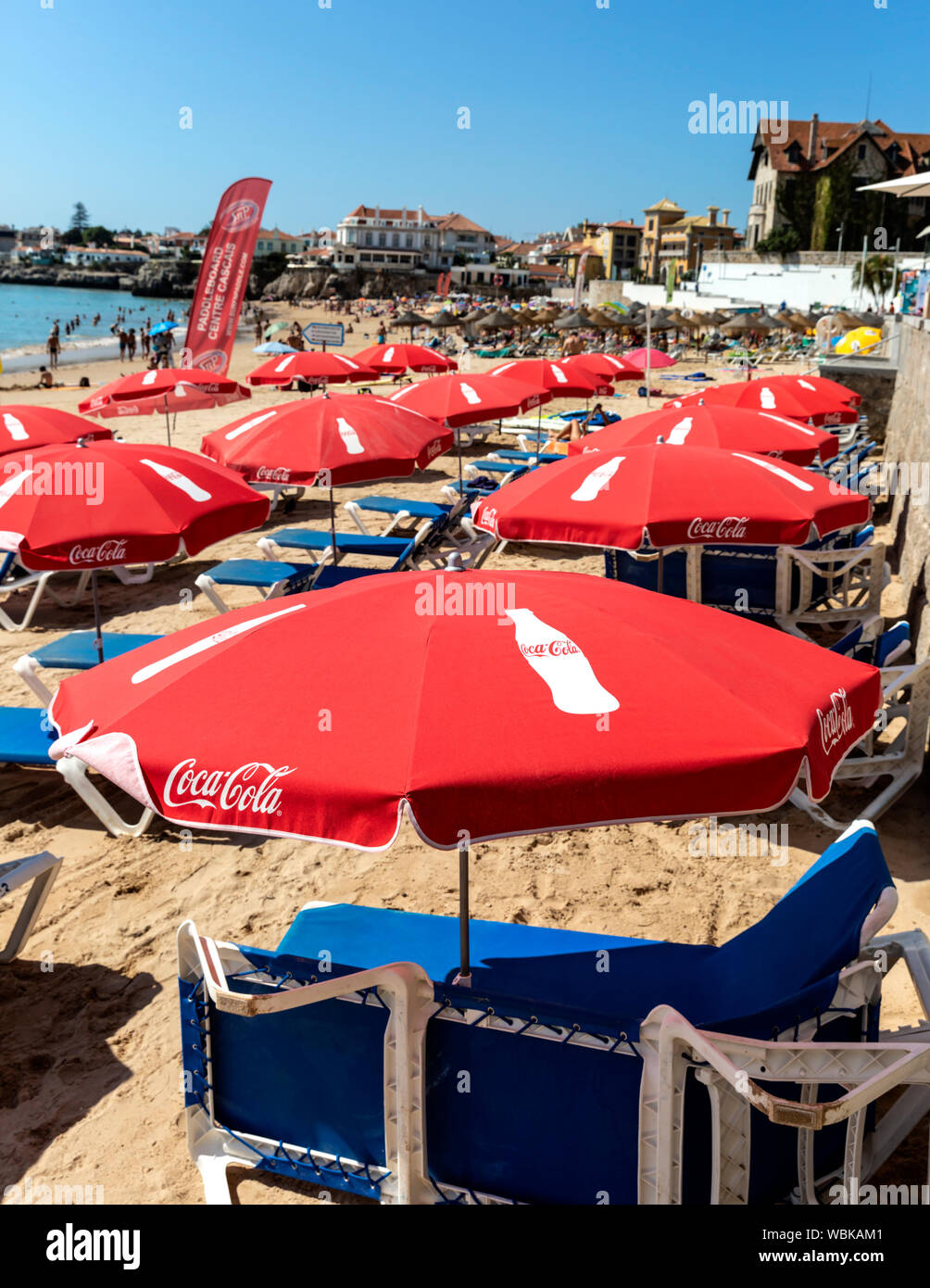 Coca Cola branded parasols and Sun loungers on Cascais beach, Portugal  Stock Photo - Alamy