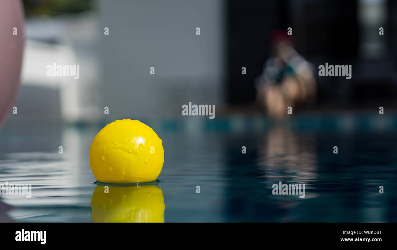 Ball in swimming pool hires stock photography and images Alamy