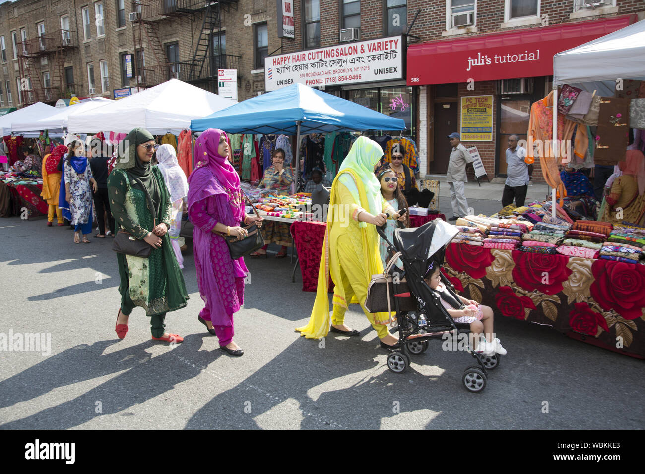 People from the Bangladeshi American community shop at a street fair in
