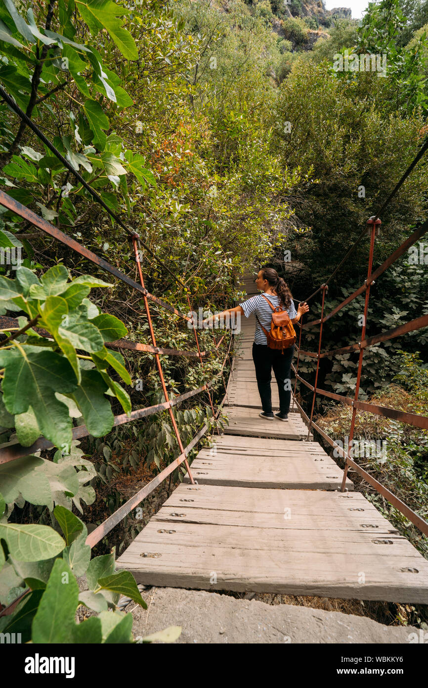 Back woman backpack wood bridge hires stock photography and images Alamy