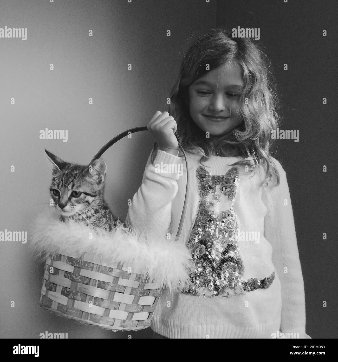 Front view girl holding cat Black and White Stock Photos & Images Alamy