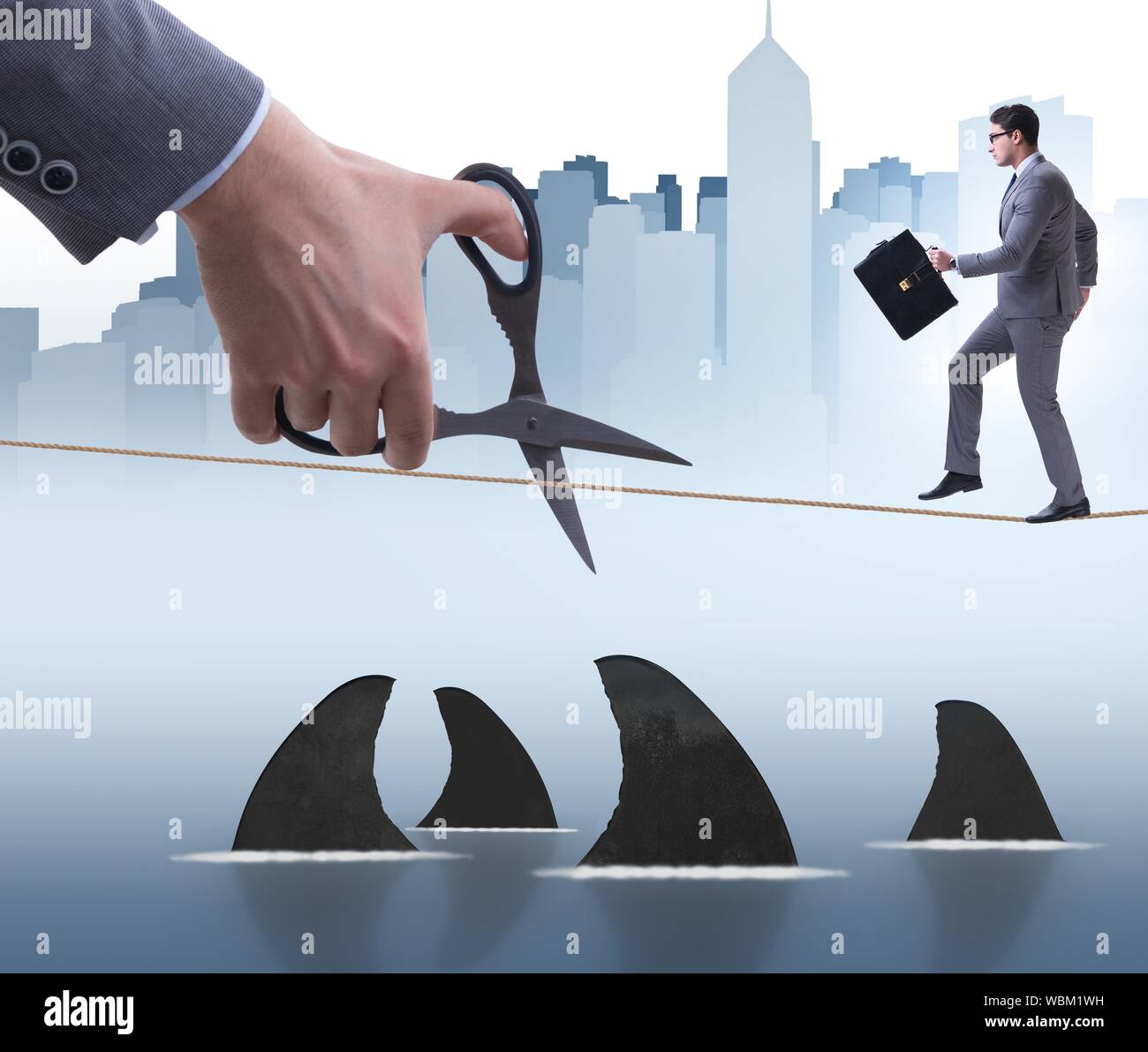 Hand Cutting Rop The hand cutting rope in business risk concept Stock Photo - Alamy