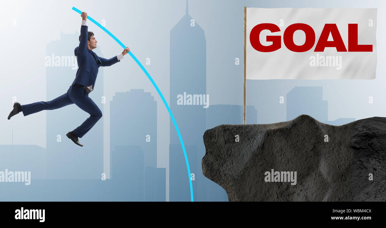 The businessman pole vaulting towards his success goal Stock Photo - Alamy