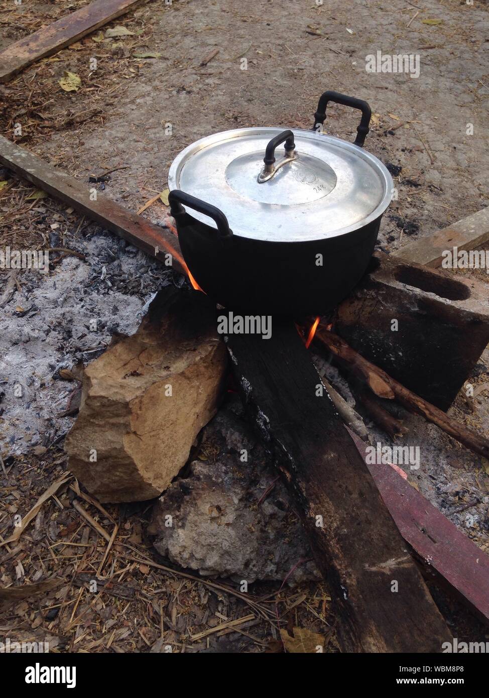 High Angle View Of Food Preparation On Wood Burning Stove Stock Photo