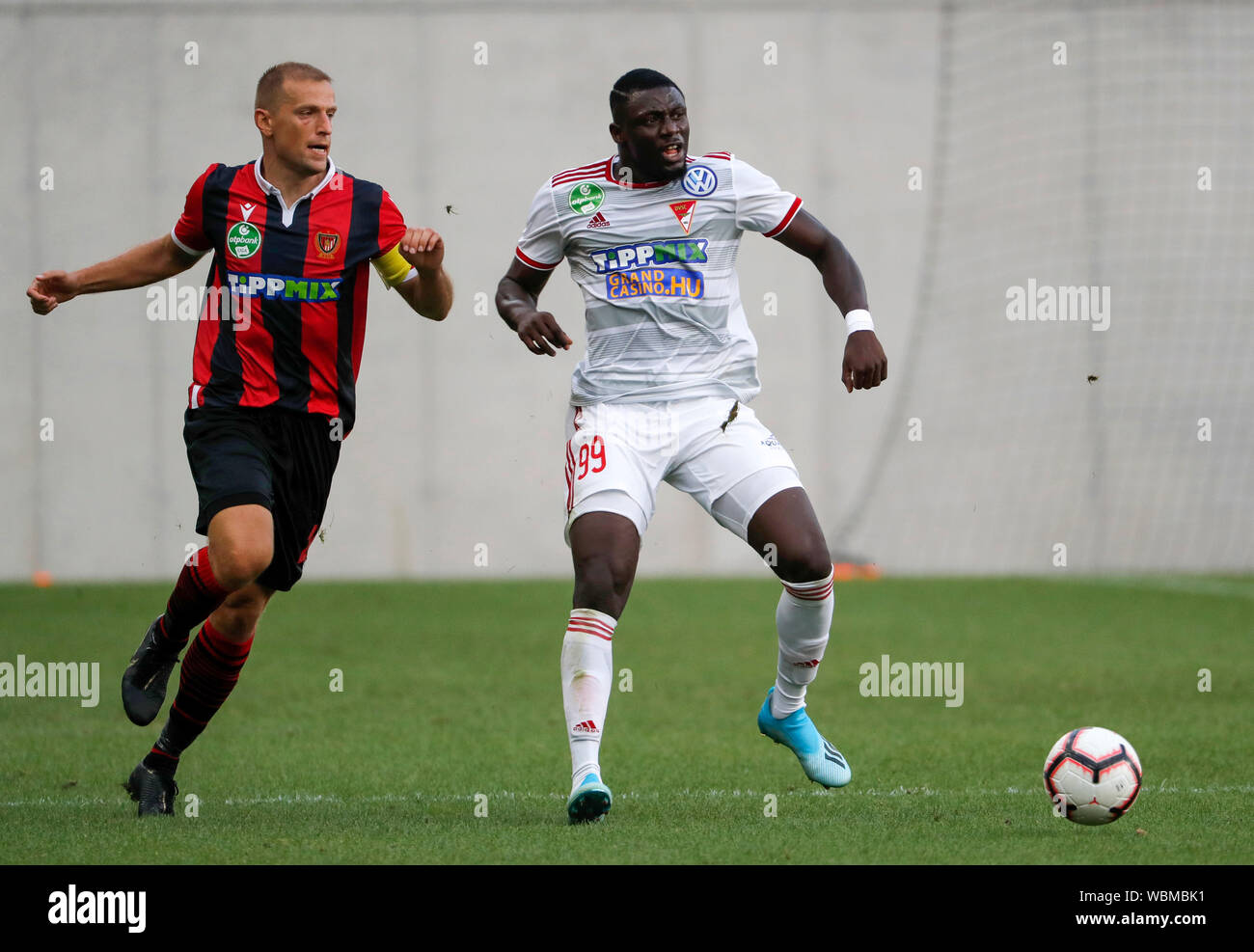 BUDAPEST, HUNGARY - AUGUST 24: (l-r) Djordje Kamber of Budapest Honved competes for the ball with Haruna Garba of DVSC during the Hungarian OTP Bank Liga match between Budapest Honved and DVSC at Nandor Hidegkuti Stadium on August 24, 2019 in Budapest, Hungary. Stock Photo