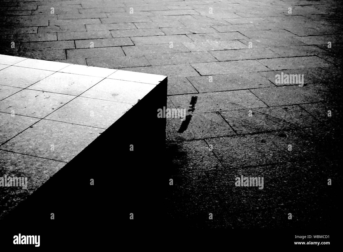 Grungy street pavement and concrete block artistic black and white photography Stock Photo