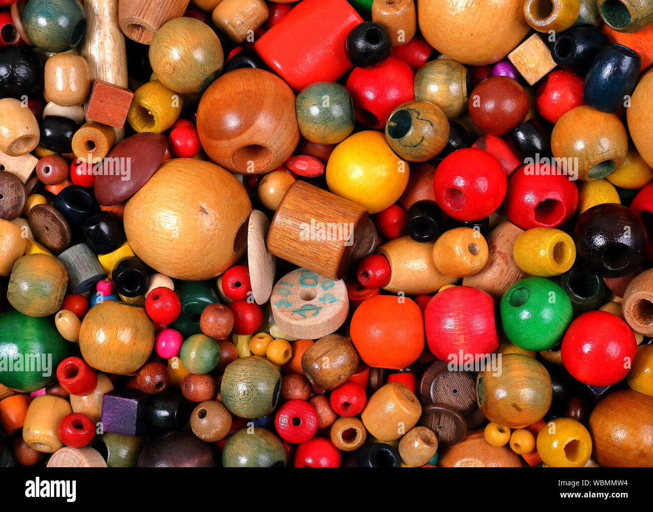 Mixed loose wooden beads for making jewellery Stock Photo - Alamy
