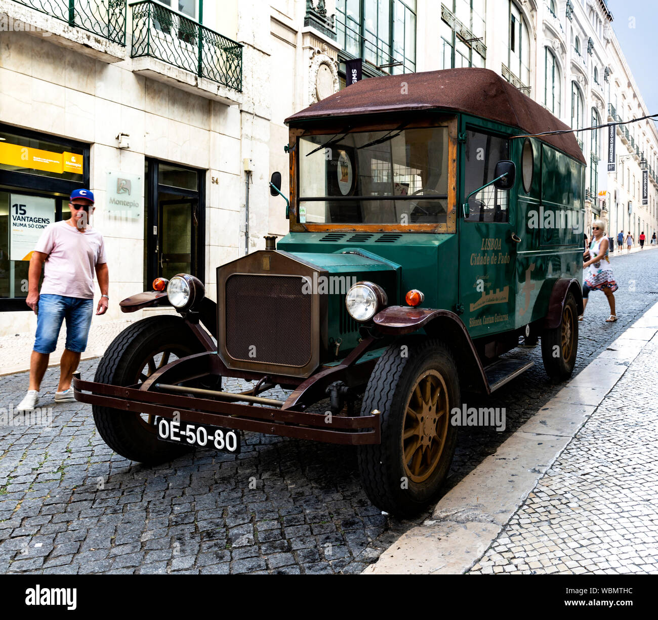 Old green vintage commercial van parked by the road side, Lisbon, Portugal. Stock Photo