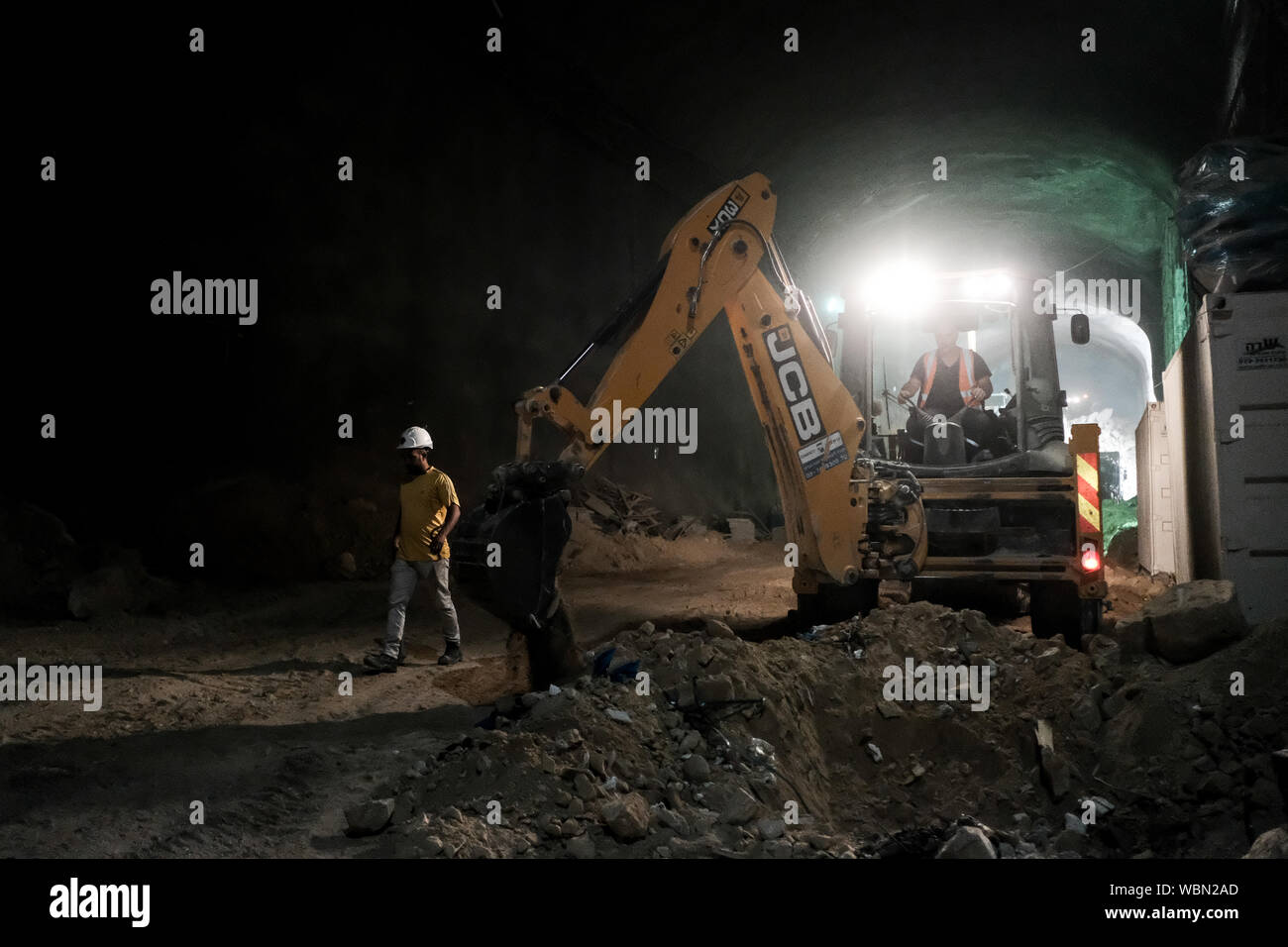 Jerusalem, Israel. 27th August, 2019. Rolzur Tunneling, commissioned by Hevra Kadisha Kehilat Yerushalaim, a Jewish burial society in Jerusalem, is nearing completion of a subterranean cemetery, in tunnels with a total length of 1.5 Km at a depth of a 15 floor building, housing over 30,000 graves, dug into the walls and floor of the structure. The $50 million project is expected to become operational in October 2019 and to provide a solution for diminishing real estate for Jewish burial in the city. Credit: Nir Alon/Alamy Live News. Stock Photo