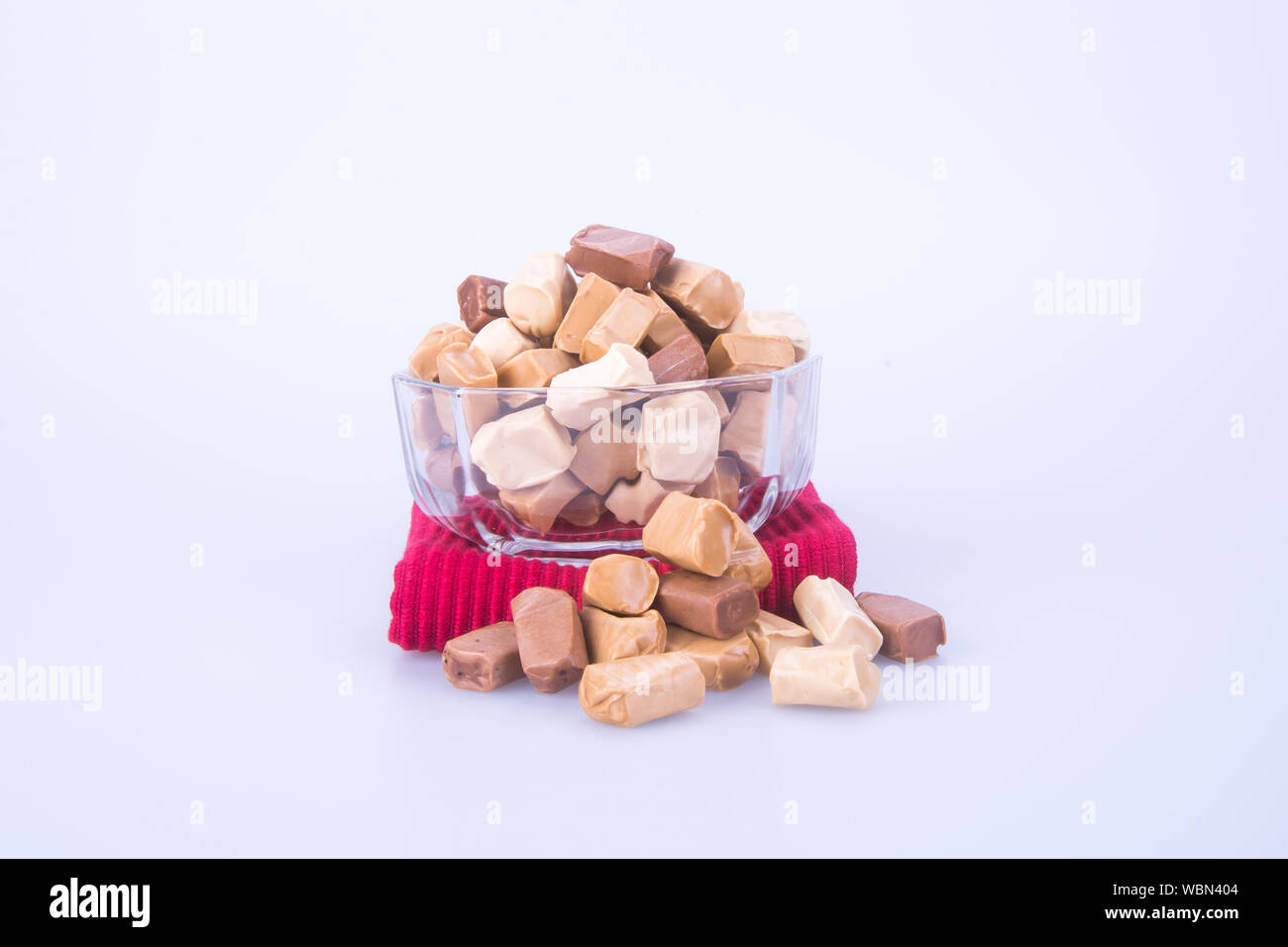 Close-up Of Chewy Toffees Over White Background Stock Photo