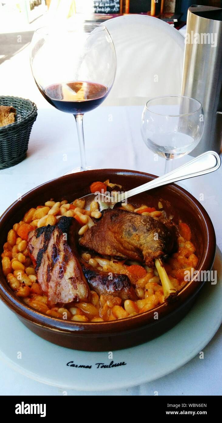 High Angle View Of Cassoulet Served In Container On Table Stock Photo