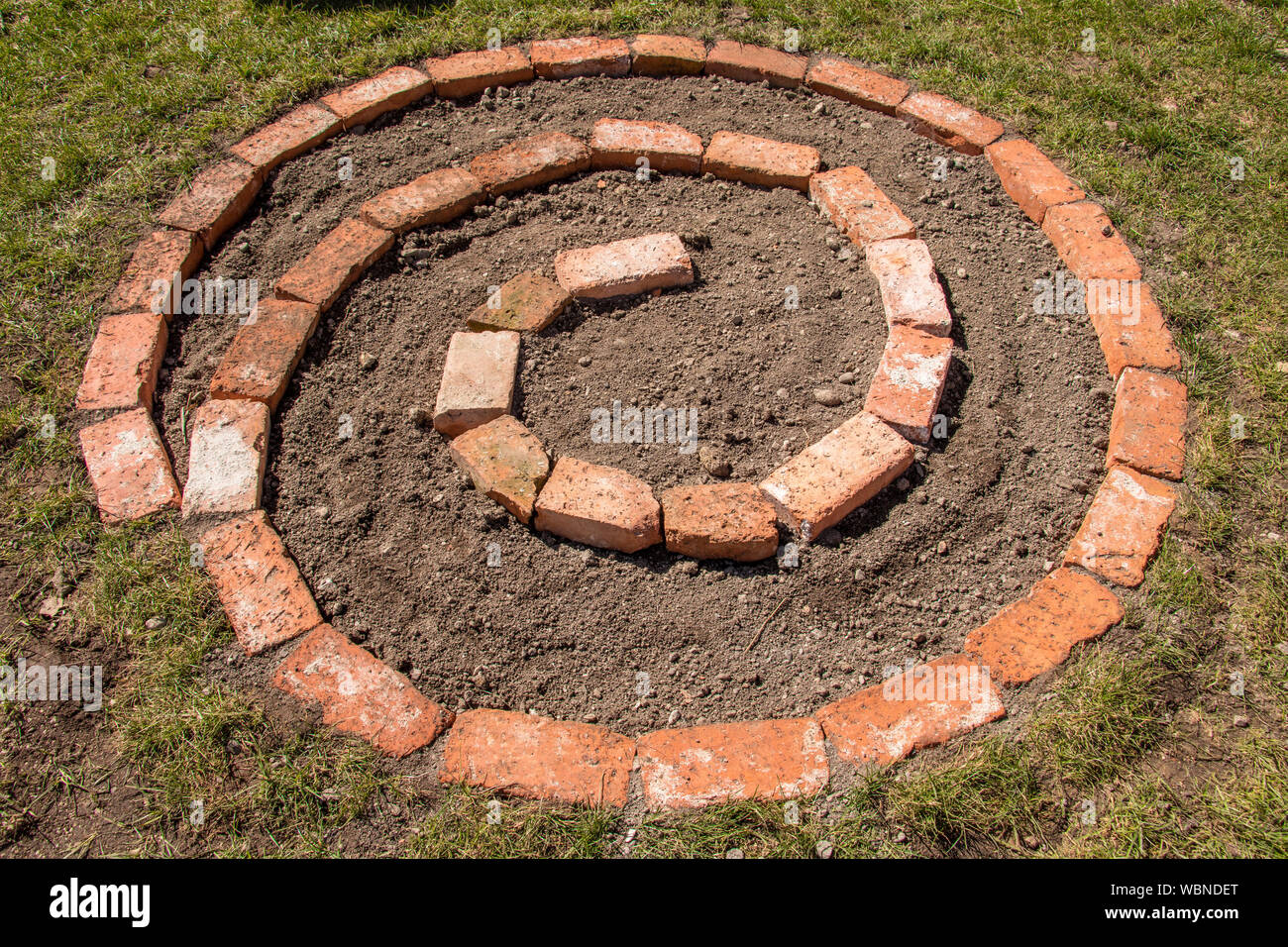 hole spiral herb garden with soil Stock Photo Alamy