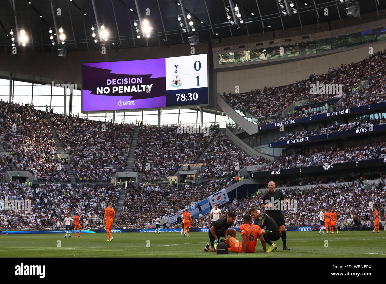 VAR decides no penalty following the incident when Harry Kane of Tottenham Hotspur goes down in the penalty area after battling with Jamaal Lascelles of Newcastle United - Tottenham Hotspur v Newcastle United, Premier League, Tottenham Hotspur Stadium, London (Tottenham), UK - 25th August 2019  Editorial Use Only - DataCo restrictions apply Stock Photo