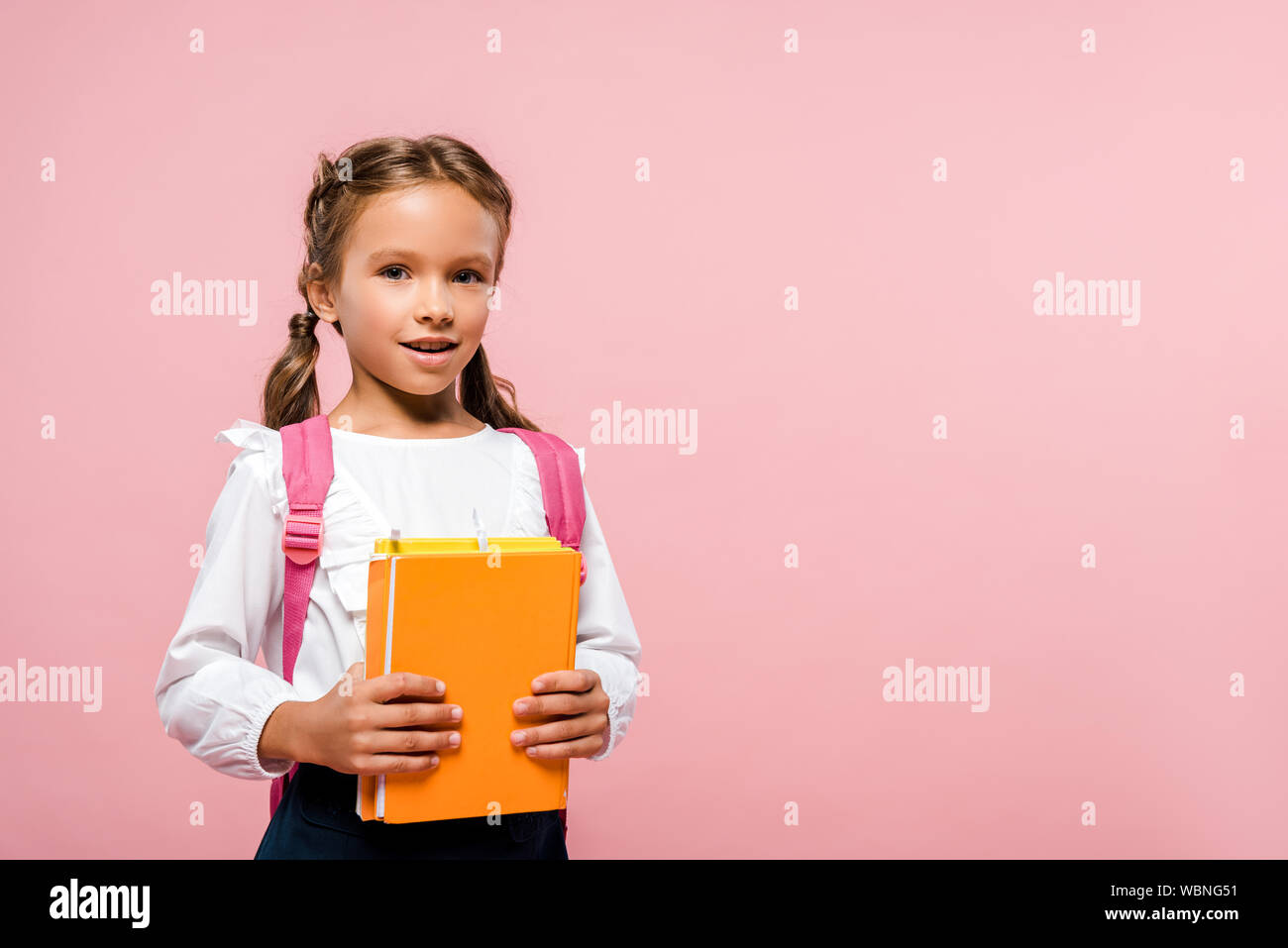 kid holding backpack
