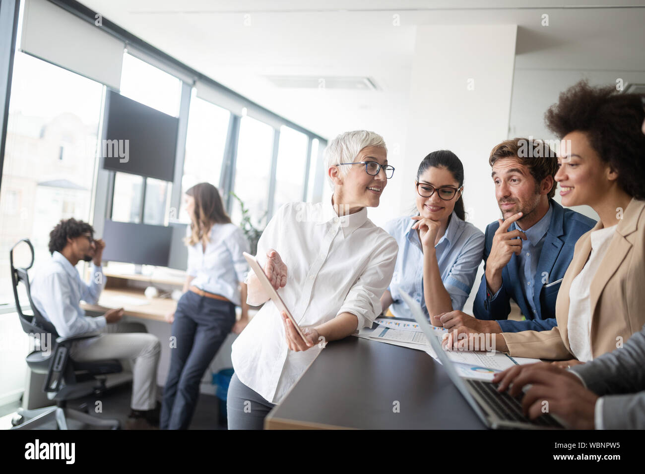 Group of successful business people at work in office Stock Photo - Alamy