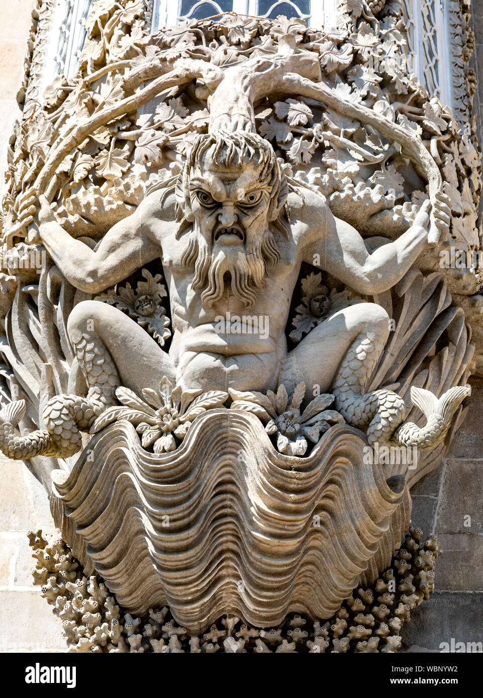 Stone decorative carving of a mythological triton, Pena Palace, Sintra, Portugal. Stock Photo